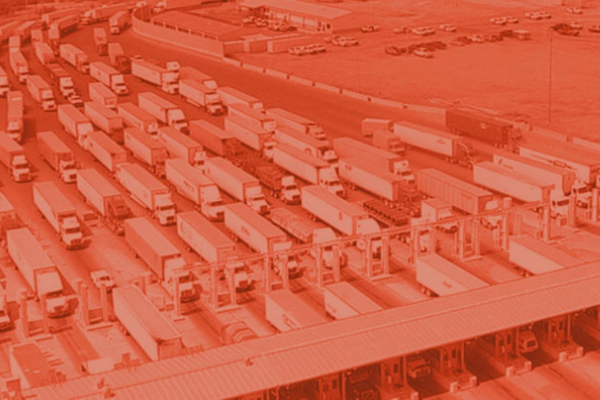 Trucks at the border with orange tint.